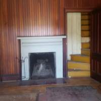 Parlor fireplace and stairs